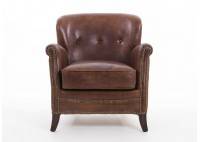 Fauteuil club en cuir et clous