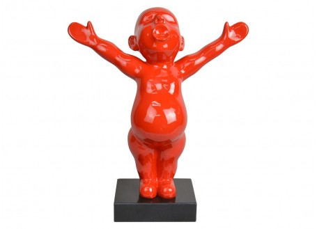 Statue of a red baby in resin